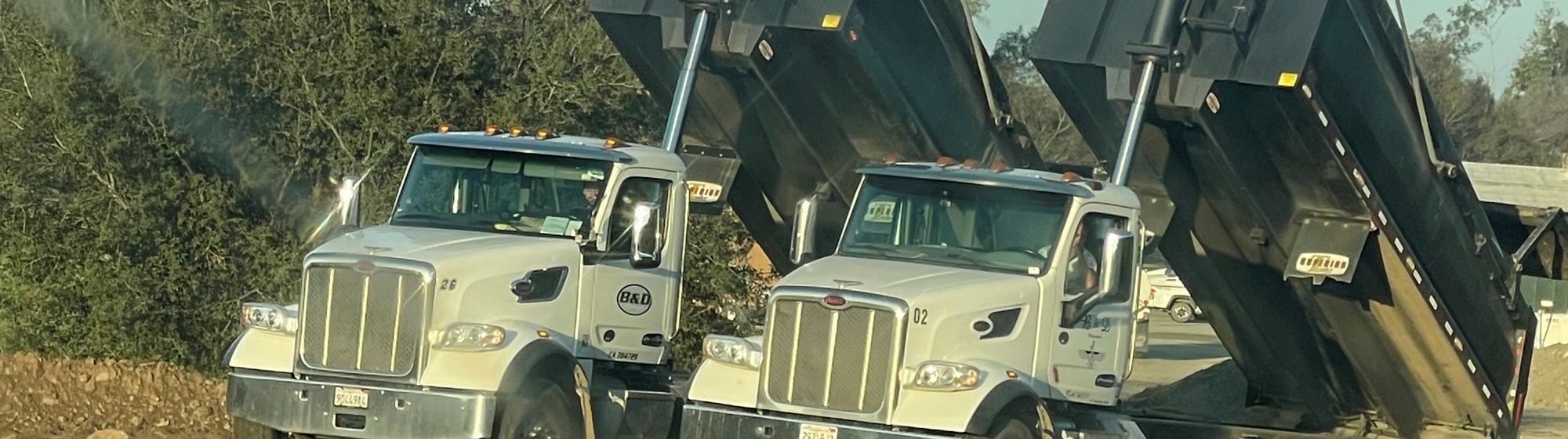 B&D Transportation bottom dump trucks on a Southern California job site
