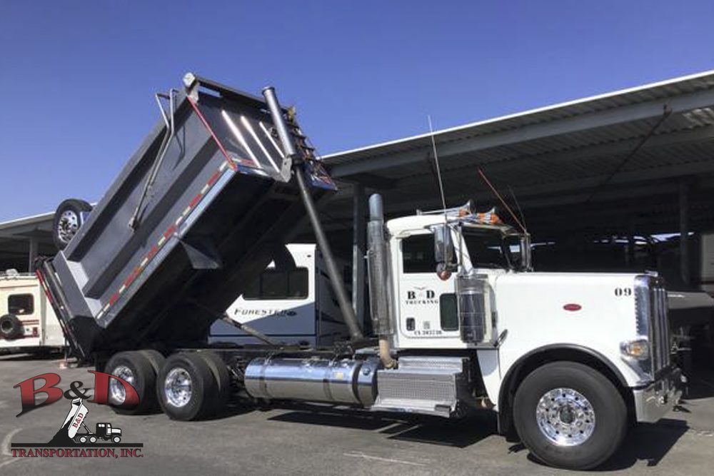 B&D Transportation super tag strong arm truck with the box raised